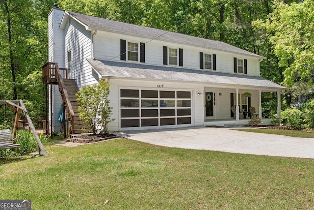 view of front of house with a porch, a chimney, a front lawn, concrete driveway, and an attached garage