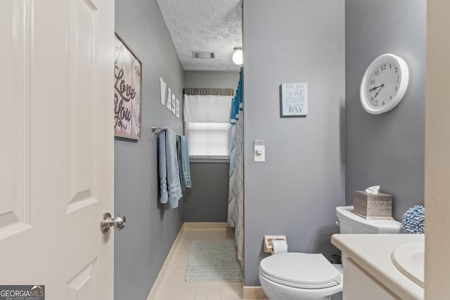 full bathroom featuring vanity, toilet, tile patterned floors, curtained shower, and visible vents