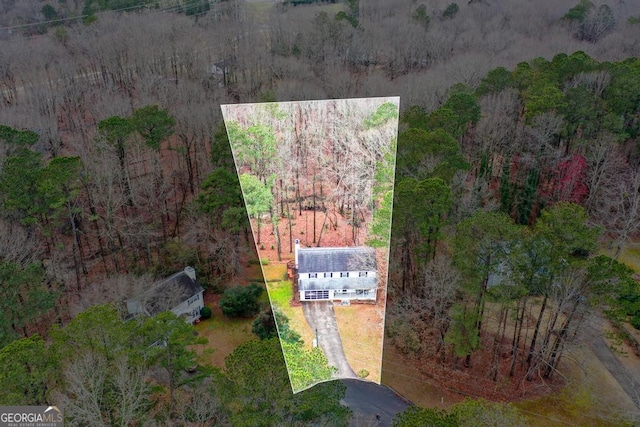 bird's eye view featuring a view of trees