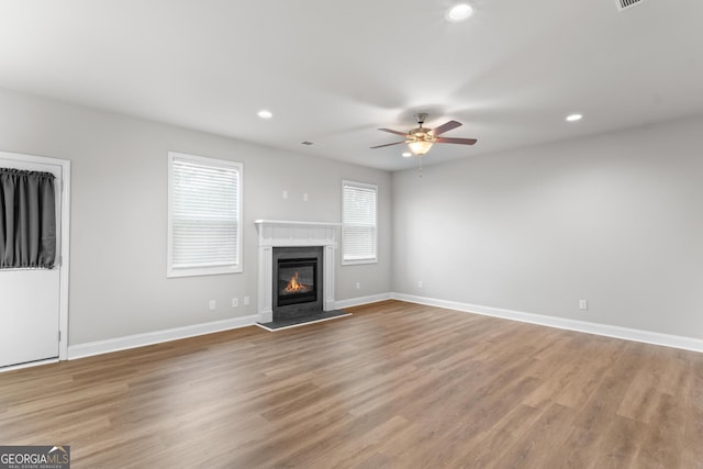 unfurnished living room featuring recessed lighting, light wood-style flooring, and ceiling fan