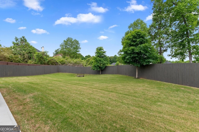 view of yard featuring a fenced backyard