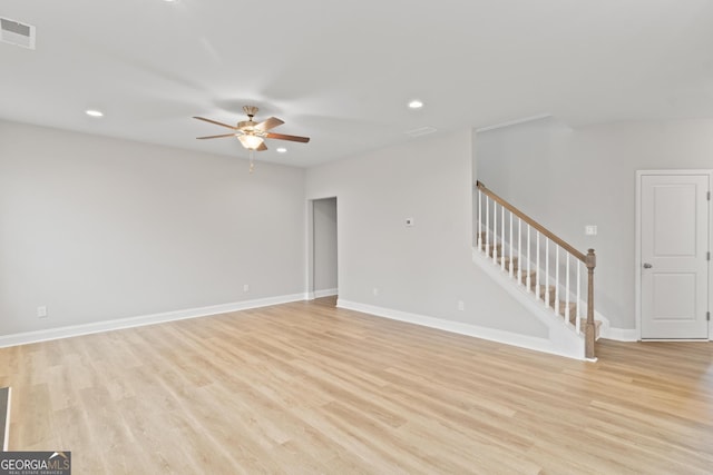unfurnished living room featuring ceiling fan, light wood-style flooring, recessed lighting, visible vents, and stairway