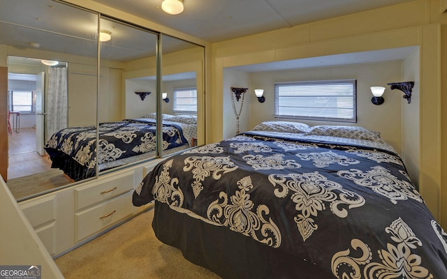 76 Periwinkle Ln, Cleveland, GA 30528 - bedroom featuring multiple windows, light carpet, and a closet