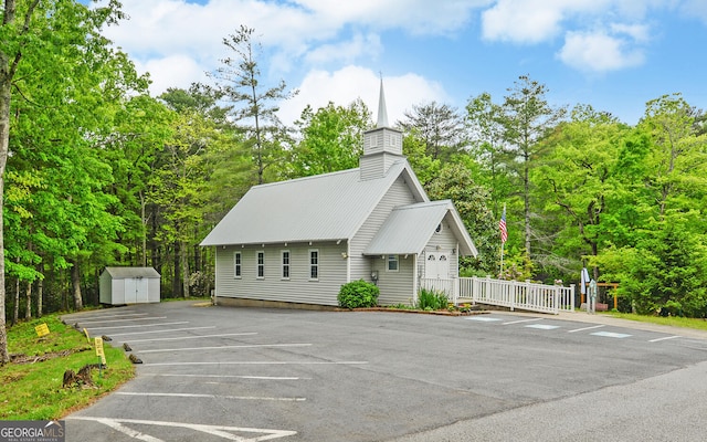76 Periwinkle Ln, Cleveland, GA 30528 - uncovered parking lot with a storage shed