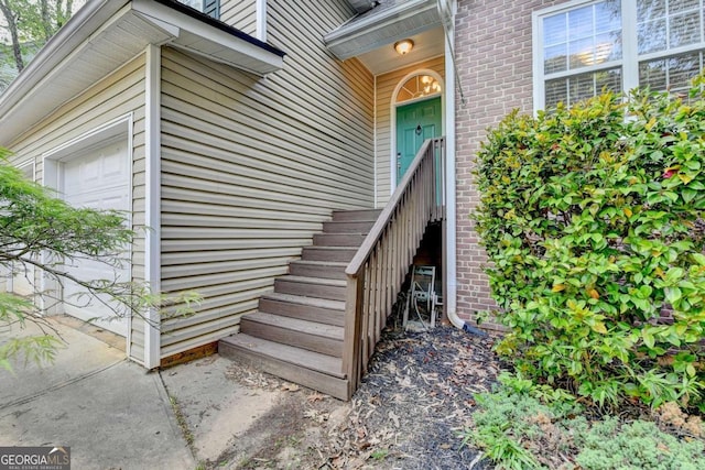 entrance to property featuring brick siding
