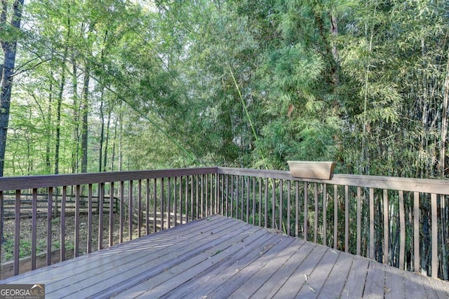 deck with a wooded view