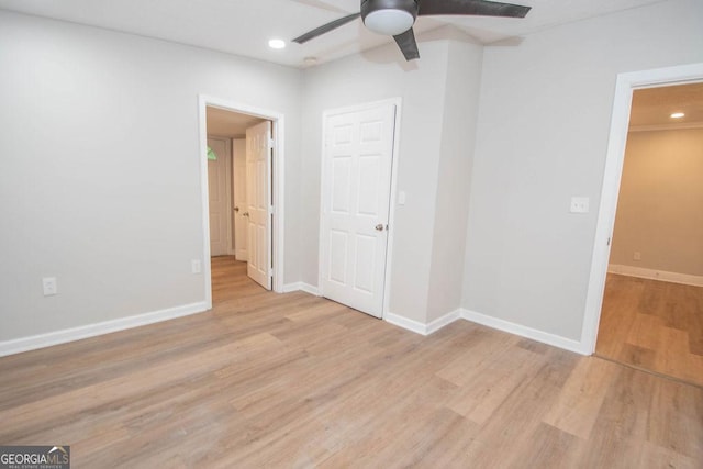 unfurnished bedroom with recessed lighting, baseboards, a ceiling fan, and light wood-style flooring