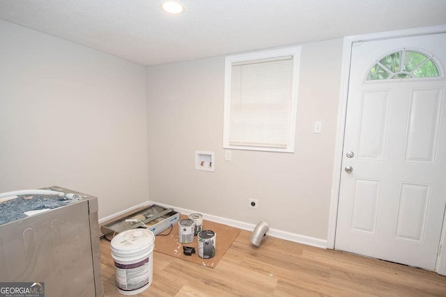 interior space with baseboards and wood finished floors