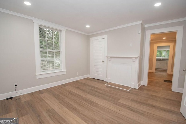 interior space featuring light wood-style floors, recessed lighting, baseboards, and a wealth of natural light