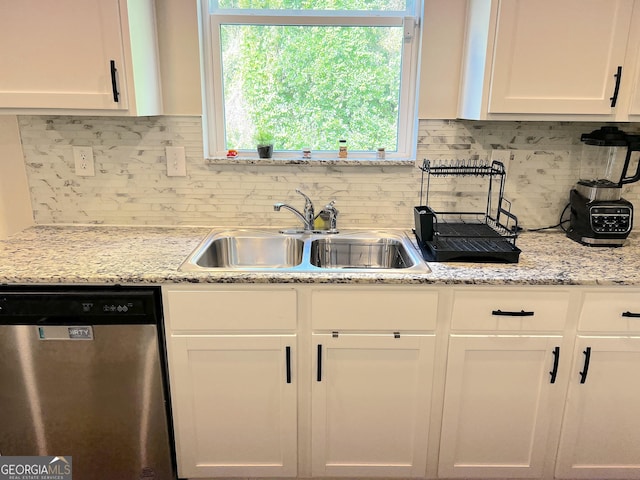 517 Starbuck Pkwy, Pendergrass, GA 30567 - kitchen with dishwasher, a sink, white cabinetry, tasteful backsplash, and light stone countertops