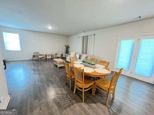 517 Starbuck Pkwy, Pendergrass, GA 30567 - dining area with dark wood finished floors, healthy amount of natural light, and baseboards