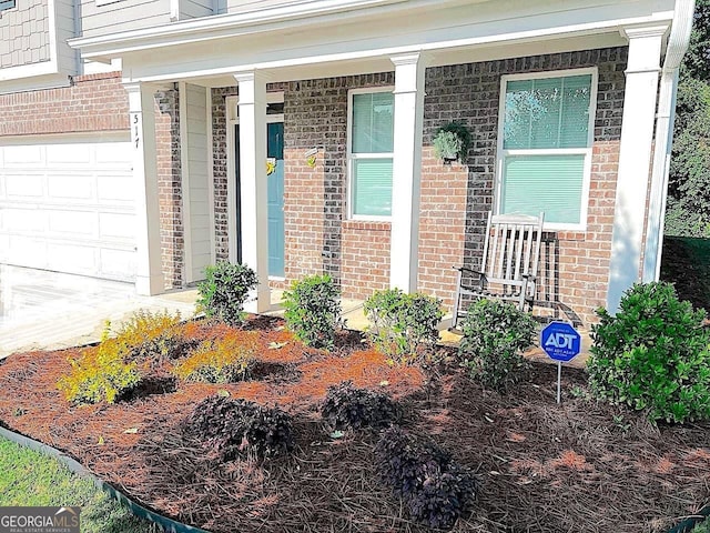 517 Starbuck Pkwy, Pendergrass, GA 30567 - entrance to property featuring brick siding and a porch