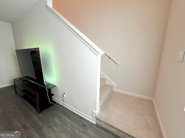 517 Starbuck Pkwy, Pendergrass, GA 30567 - stairs with baseboards and wood finished floors