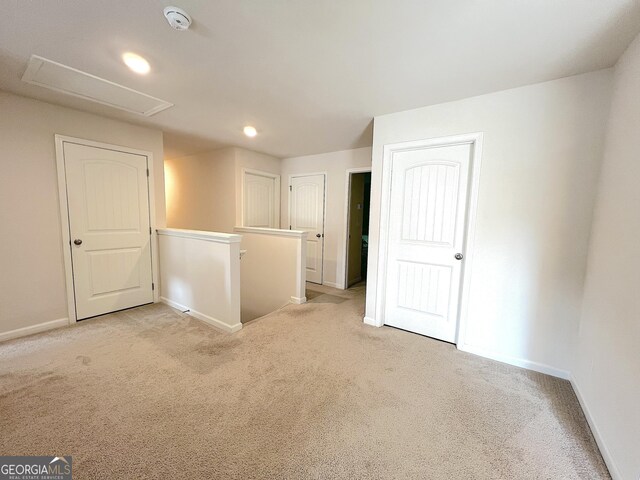517 Starbuck Pkwy, Pendergrass, GA 30567 - unfurnished bedroom featuring light carpet, baseboards, attic access, and recessed lighting