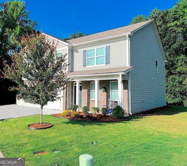 517 Starbuck Pkwy, Pendergrass, GA 30567 - view of front of house with covered porch, brick siding, a front lawn, a garage, and a shingled roof