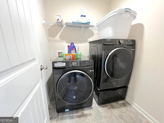 517 Starbuck Pkwy, Pendergrass, GA 30567 - laundry room featuring washer and dryer and baseboards