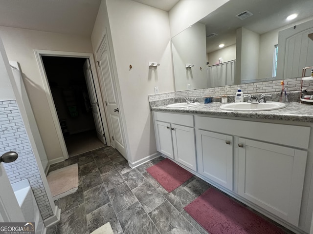 517 Starbuck Pkwy, Pendergrass, GA 30567 - full bath with double vanity, baseboards, tasteful backsplash, a shower with curtain, and stone finish flooring