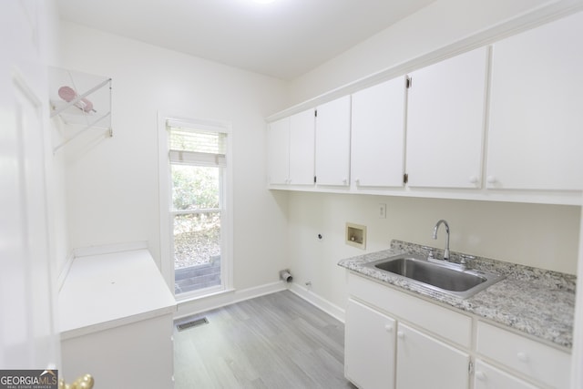5685 Commons Ln, Alpharetta, GA 30005 - clothes washing area featuring visible vents, cabinet space, a sink, washer hookup, and hookup for a gas dryer
