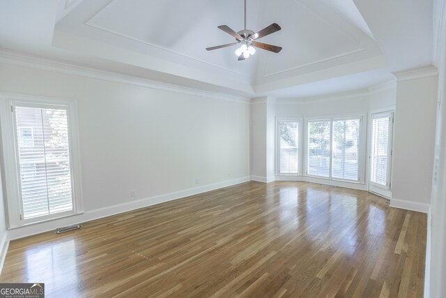 5685 Commons Ln, Alpharetta, GA 30005 - empty room featuring visible vents, a ceiling fan, a raised ceiling, and wood finished floors