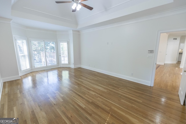 5685 Commons Ln, Alpharetta, GA 30005 - unfurnished living room featuring baseboards, ceiling fan, and wood finished floors