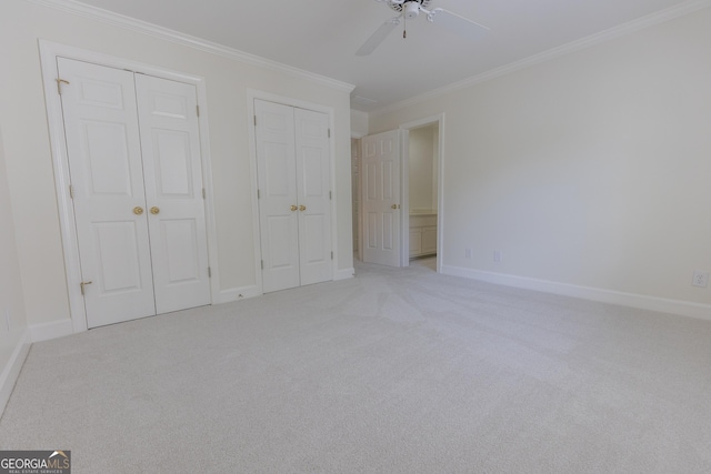 5685 Commons Ln, Alpharetta, GA 30005 - unfurnished bedroom with crown molding, carpet flooring, multiple closets, and baseboards