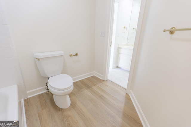 5685 Commons Ln, Alpharetta, GA 30005 - full bath featuring baseboards, toilet, and wood finished floors