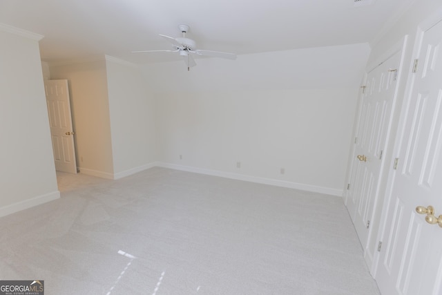5685 Commons Ln, Alpharetta, GA 30005 - interior space with crown molding, baseboards, a ceiling fan, and light colored carpet
