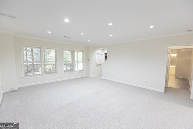 5685 Commons Ln, Alpharetta, GA 30005 - unfurnished living room featuring crown molding, baseboards, recessed lighting, and light colored carpet