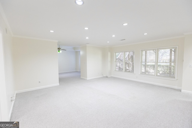 5685 Commons Ln, Alpharetta, GA 30005 - unfurnished living room with baseboards, ornamental molding, light carpet, and recessed lighting