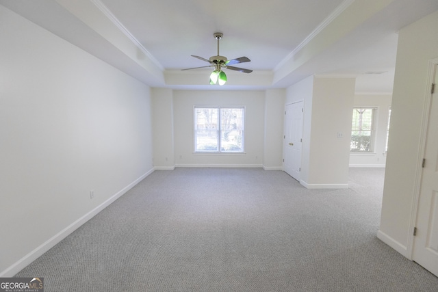 5685 Commons Ln, Alpharetta, GA 30005 - carpeted spare room featuring baseboards, ornamental molding, ceiling fan, and a tray ceiling