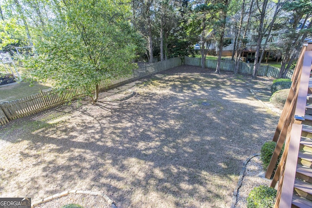 5685 Commons Ln, Alpharetta, GA 30005 - view of yard with a fenced backyard