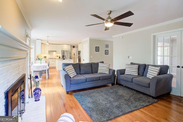 1812 Riverton Dr, Suwanee, GA 30024 - living area featuring crown molding, ceiling fan, and light wood-type flooring