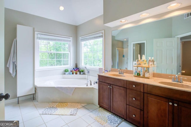 1812 Riverton Dr, Suwanee, GA 30024 - bathroom with double vanity, tile patterned flooring, a sink, and a garden tub