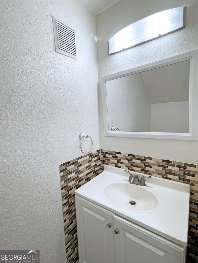 1812 Ashborough Cir SE Unit C, Marietta, GA 30067 - bathroom featuring tile walls, visible vents, and vanity