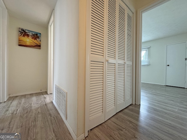 1812 Ashborough Cir SE Unit C, Marietta, GA 30067 - corridor with baseboards, visible vents, and wood finished floors