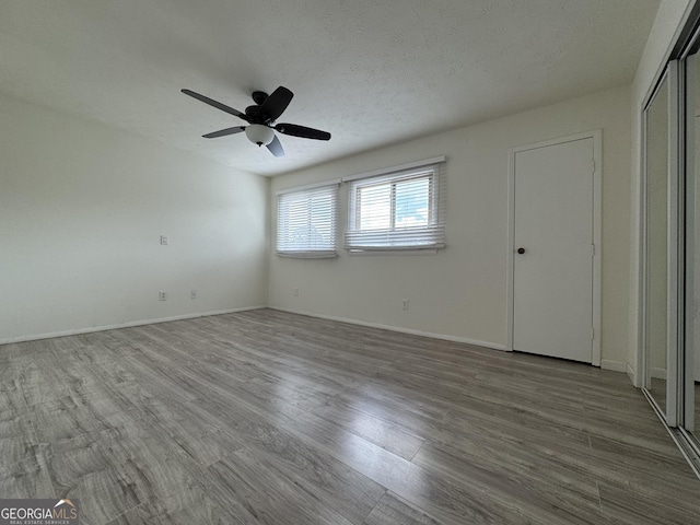 1812 Ashborough Cir SE Unit C, Marietta, GA 30067 - unfurnished bedroom with baseboards, ceiling fan, and wood finished floors