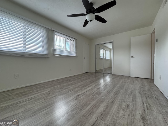 1812 Ashborough Cir SE Unit C, Marietta, GA 30067 - unfurnished bedroom featuring baseboards, a ceiling fan, a closet, and wood finished floors