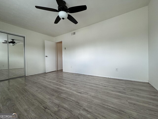 1812 Ashborough Cir SE Unit C, Marietta, GA 30067 - unfurnished bedroom featuring baseboards, visible vents, wood finished floors, and a closet