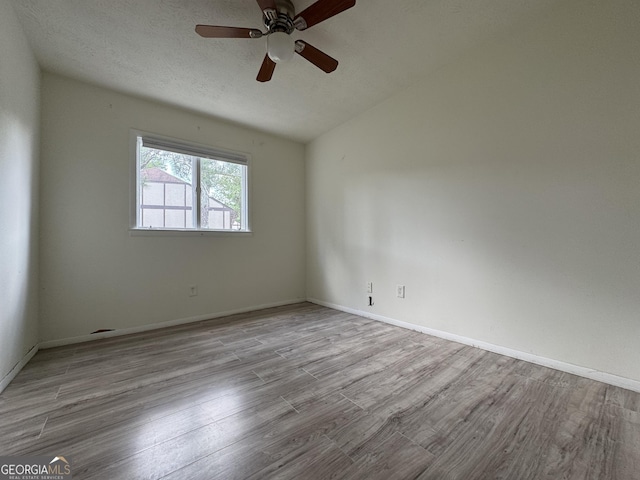 1812 Ashborough Cir SE Unit C, Marietta, GA 30067 - empty room featuring baseboards, a ceiling fan, wood finished floors, and vaulted ceiling