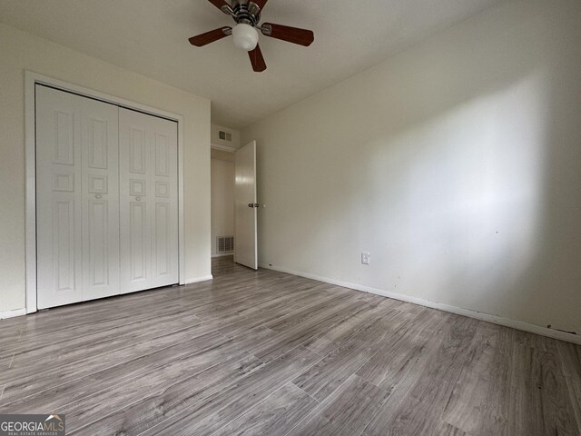 1812 Ashborough Cir SE Unit C, Marietta, GA 30067 - unfurnished bedroom with baseboards, a closet, wood finished floors, and visible vents