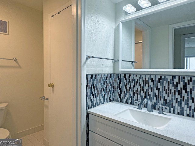 1812 Ashborough Cir SE Unit C, Marietta, GA 30067 - bathroom with decorative backsplash, visible vents, tile patterned flooring, vanity, and toilet