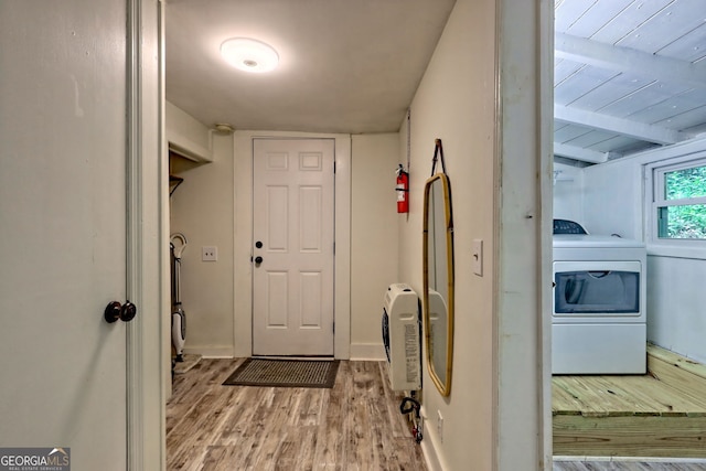 49 Toole St, Clayton, GA 30525 - clothes washing area featuring washer / clothes dryer, wood finished floors, heating unit, and baseboards