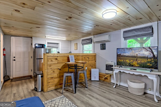 49 Toole St, Clayton, GA 30525 - office space featuring a wall unit AC, wood ceiling, light wood-style flooring, plenty of natural light, and heating unit