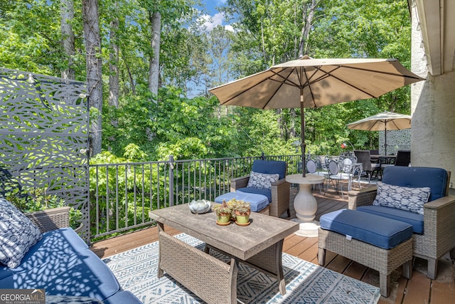 wooden terrace with outdoor dining area