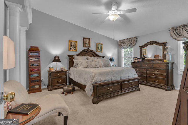 bedroom with decorative columns, light carpet, baseboards, a ceiling fan, and vaulted ceiling
