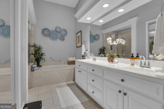 bathroom with double vanity, recessed lighting, a sink, and tile patterned flooring