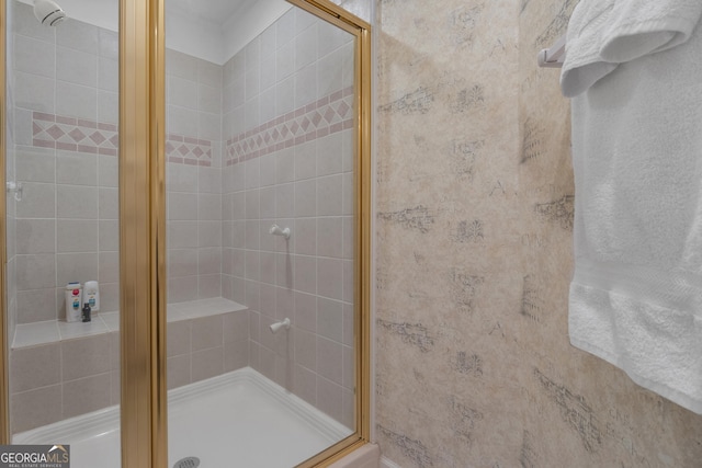 bathroom featuring a shower stall