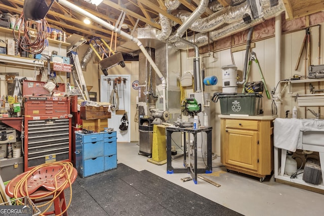 unfinished below grade area featuring a workshop area