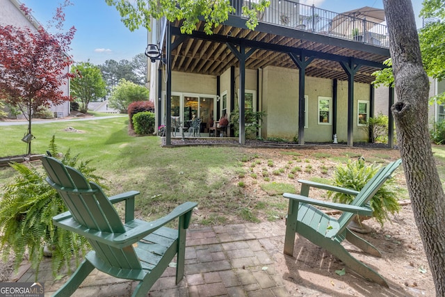 view of yard with a deck and a patio area