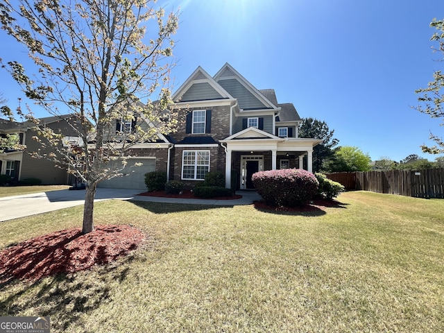 5015 Scuppernong Ct, Austell, GA 30106 - craftsman house with a garage, fence, a front yard, brick siding, and driveway